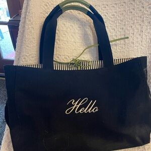 Kate Spade Black Canvas Tote with white Hello Embroidery on front and Goodbye